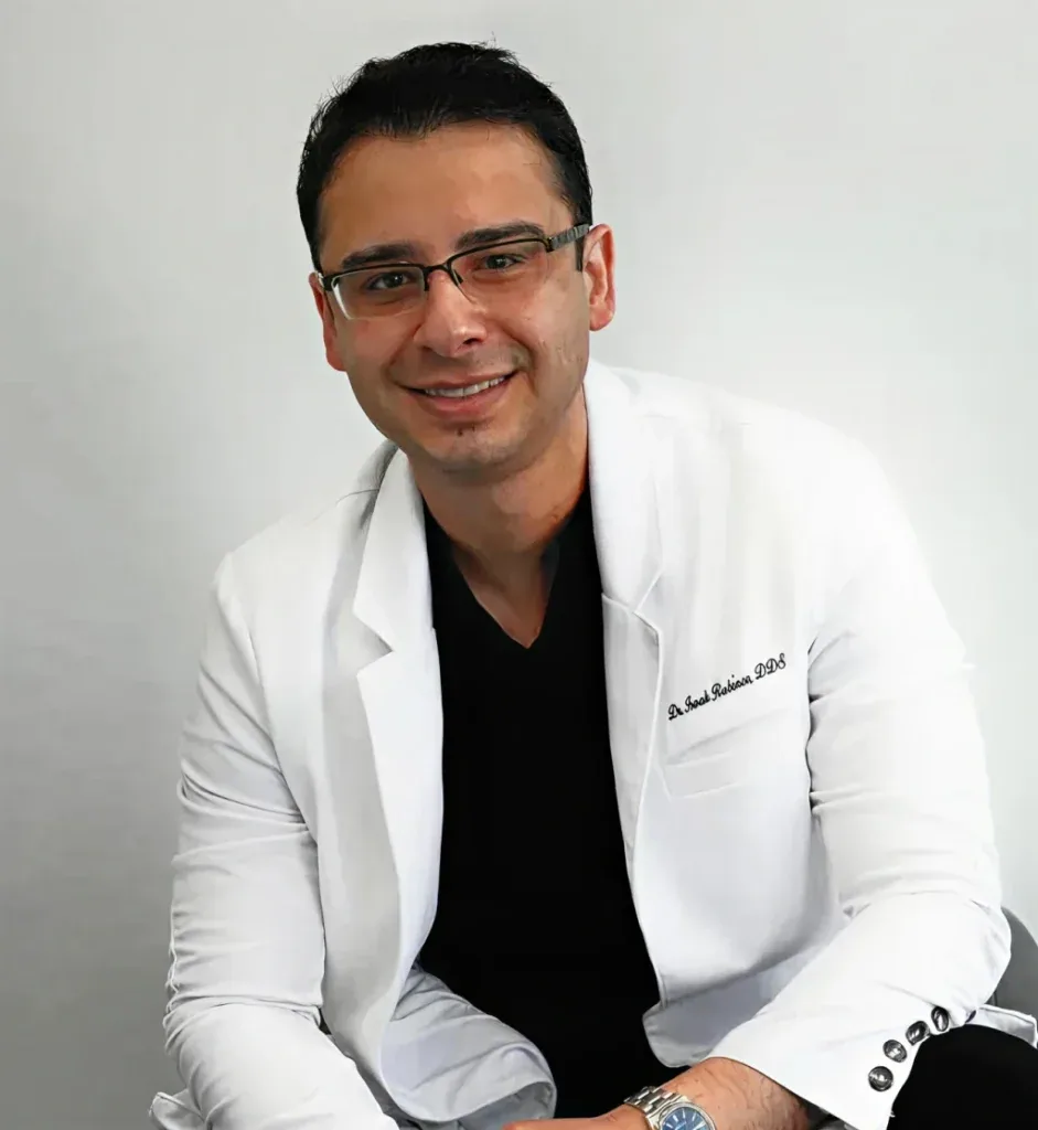 Dr. Isaak Rubinov, D.D.S., dentist at Modern Dental Hub, in a white coat